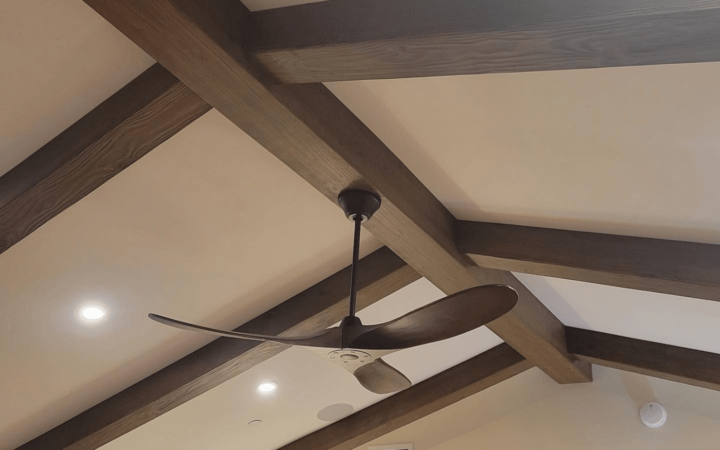 Custom faux wood ceiling beam installation