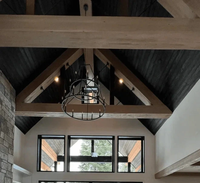 Faux wood beams and tongue and groove boarding on a vaulted ceiling