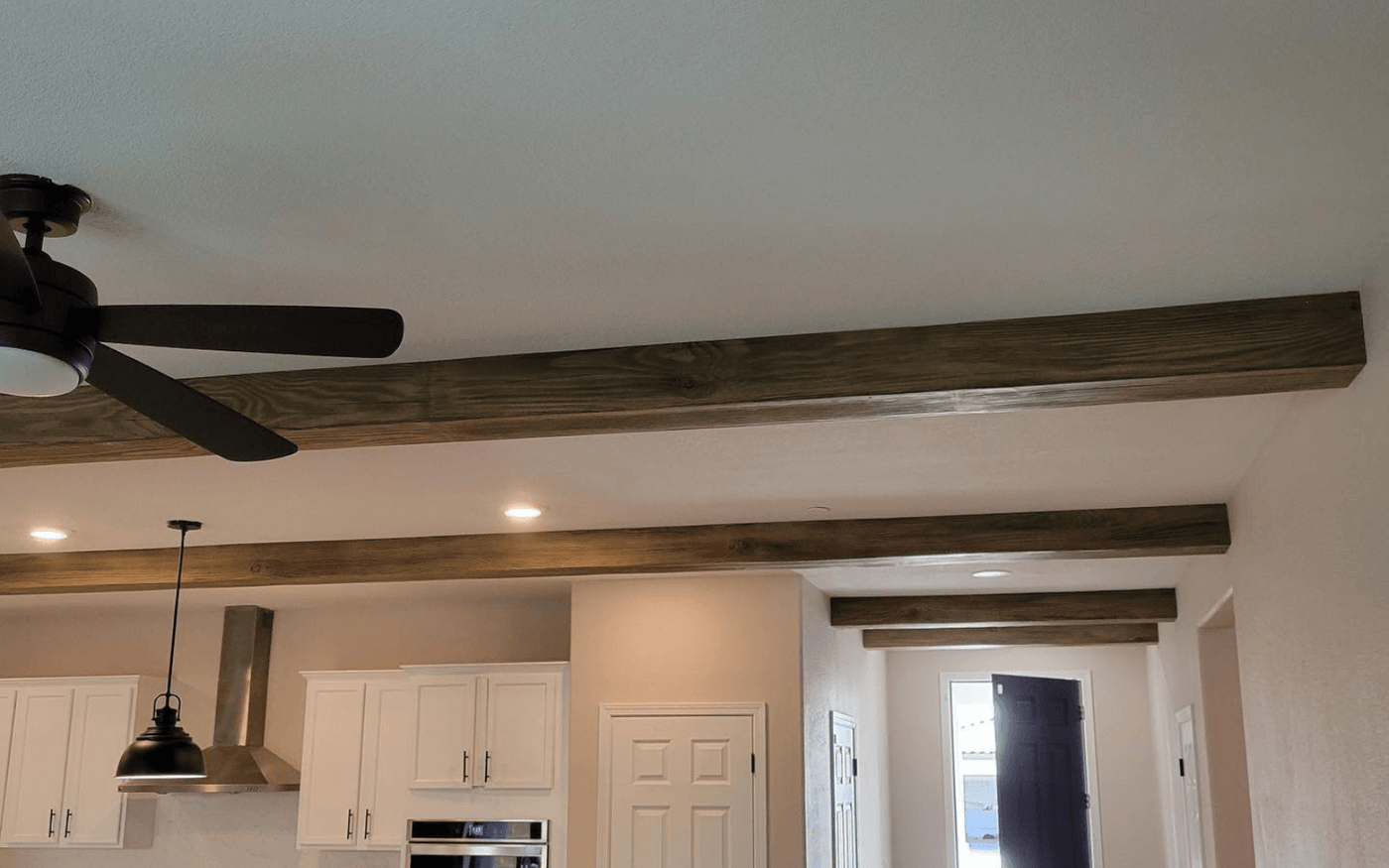 Custom foam faux beam installation in residential home projects
